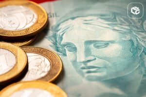 Moedas brasileiras sobre nota de Real, com foco em RPVs.